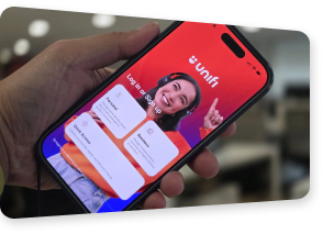 Customer holding a phone with the Unifi app sign-in screen