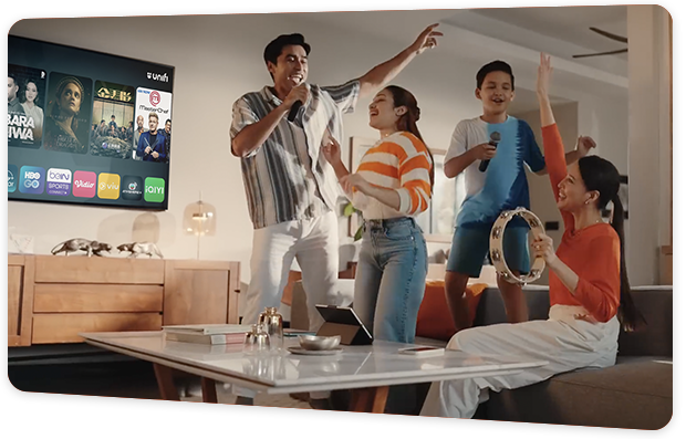 A family enjoying on the living room with a streaming app running on the background