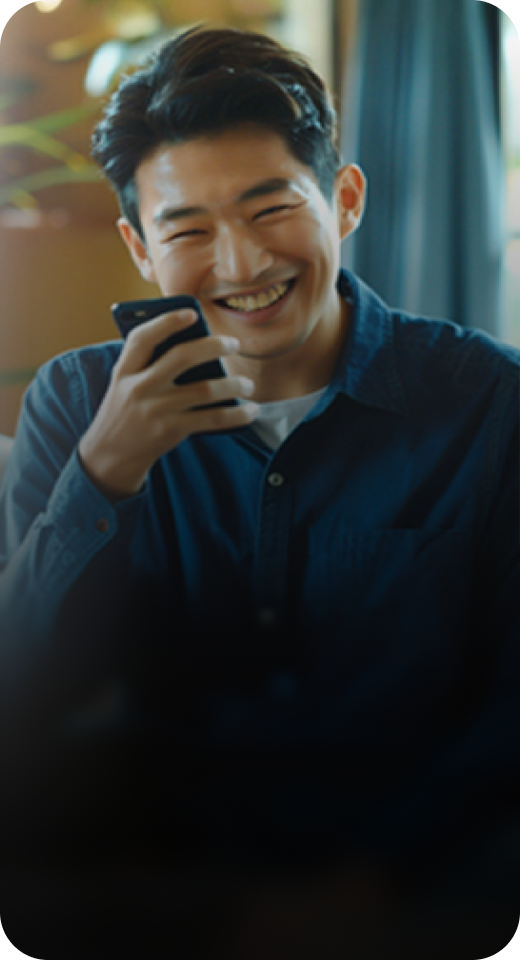 Smiling person holding phone